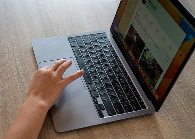 small hand typing on laptop